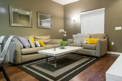 a living room with a couch and a table at Charming decorated 3BED at West Lucaya Resort 55 in Kissimmee