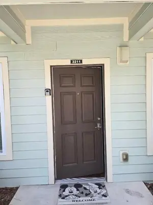 a black door on the side of a house at Charming decorated 3BED at West Lucaya Resort 55 in Kissimmee