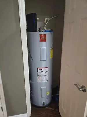 a water heater in a room next to a door at Charming decorated 3BED at West Lucaya Resort 55 in Kissimmee