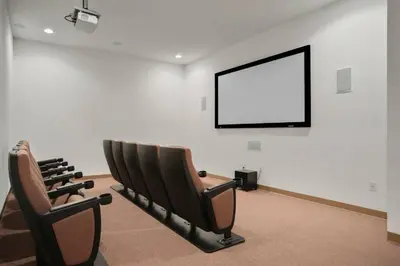 a row of chairs in a room with a blank screen at Cozy apartment near Disney with 3 bedrooms 58 in Kissimmee