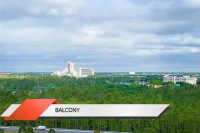 a red and white gas station with a city in the background at Spider-Man-themed condo near Disney, Sea World, Universal and OCCC with pool, spa, restaurants, shuttle, private balcony, and view of fireworks shows in Orlando