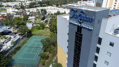 an aerial view of a tennis court in front of a building at 2 suites ground floor apartment near Intern Drive in Orlando
