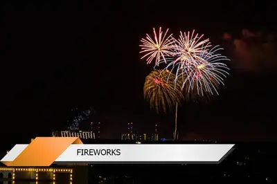 a fireworks display in the sky over a city at Lion King-themed condo near Disney, Sea World, Universal and OCCC with pool, spa, restaurants, shuttle, private balcony, and the BEST view of fireworks shows in Orlando