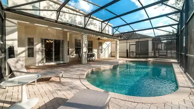 a swimming pool in a house with a glass roof at The Skywalker in Orlando