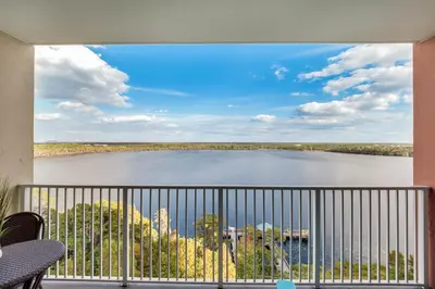 a view of a lake from a balcony at K and J Orlando in Orlando
