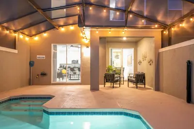 a swimming pool in the middle of a house at Luxury Stay Near Disney Storey Lake Resort 2568 in Kissimmee