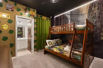 a kids room with a bunk bed and green walls at Luxury 12BR Villa w/ Pool & Spa Near Disney in Kissimmee