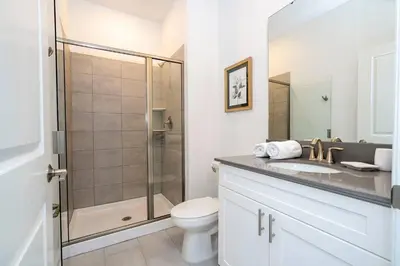 a bathroom with a shower and a toilet and a sink at Fantastic Mickey house Waterpark near Disney 2572 in Kissimmee