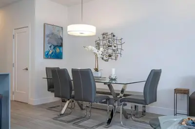 a dining room with a table and chairs at Comfortable home Near Disney & Private Pool 17414 in Orlando