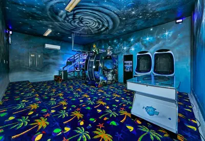 a room with a space themed room with a ceiling at Remarkable Mansion Sleep 36 Cinema-Bowling Alley & More in Kissimmee