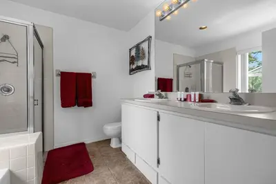 a white bathroom with a sink and a toilet at 2974 Viscount Villa 3bed Pool in Kissimmee