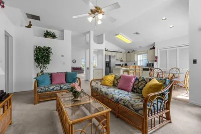 a living room with two couches and a table at 2974 Viscount Villa 3bed Pool in Kissimmee
