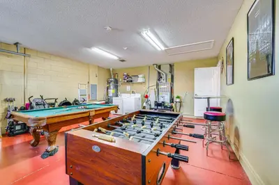 a large room with a pool table and a pool table at 11 Mi to WDW Kissimmee House with Private Pool! in Kissimmee