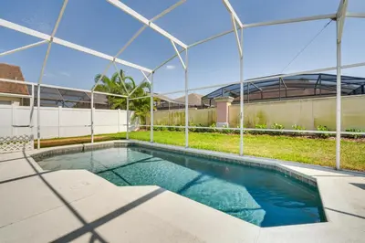 an empty swimming pool with a metal structure at 11 Mi to WDW Kissimmee House with Private Pool! in Kissimmee