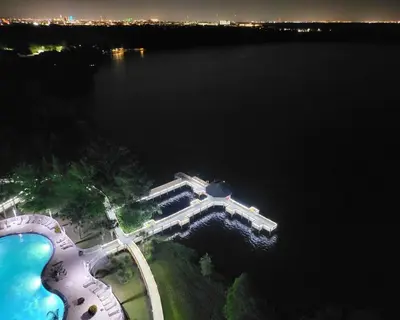 an aerial view of a building next to a body of water at Sunshine Oasis - Orlando Lakefront Luxury in Orlando