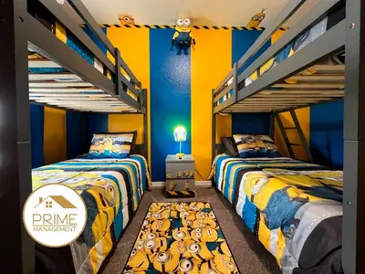 two bunk beds in a room with two beds at Cozy 4bdhome By Lake Prime Location Disney in Kissimmee