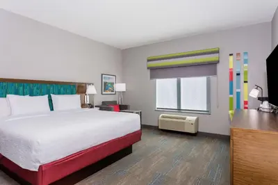 a hotel room with a bed and a window at Hampton Inn By Hilton Ocoee Orlando in Orlando