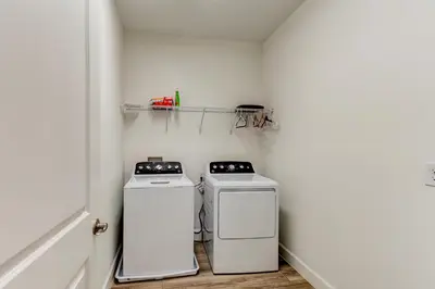 two washing machines sitting next to each other in a room at The Hub Downtown in Sanford
