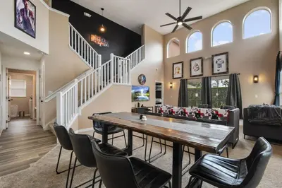 a dining room with a table and chairs at Attention Star Wars fans Amazing 6 BR pool in Kissimmee