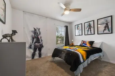 a bedroom with a superhero mural on the wall at Attention Star Wars fans Amazing 6 BR pool in Kissimmee