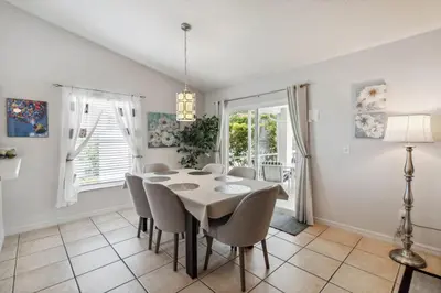 a dining room with a table and chairs at Indian Ridge- 4 bedroom home with Game Room in Orlando