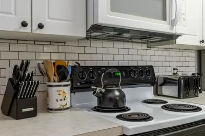 a kitchen counter with a stove with a tea kettle on it at Star Wars Themed Home at Windsor Palms in Kissimmee