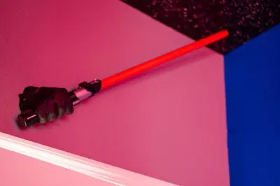a red baseball bat on top of a pink wall at Star Wars Themed Home at Windsor Palms in Kissimmee