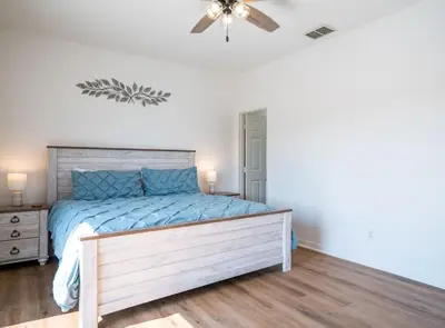 a bedroom with a bed and a ceiling fan at Disney Retreat Lakeview townhome - close to golf in Orlando
