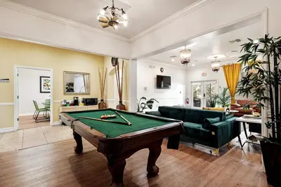 a living room with a pool table in it at Banana Leaf Villa-Marley Junior Suite with Living Room in Orlando
