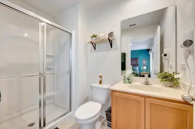 a bathroom with a shower and a toilet and a sink at Cozy townhouse in Encantada resort- 5 miles from Disney in Kissimmee