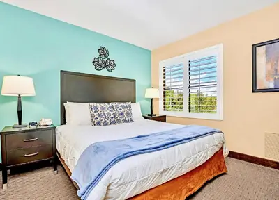 a bedroom with a large bed and a window at Apartment w Hot Tub Pool - Near Universal Studios in Orlando