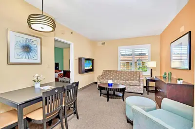 a living room with a couch and a table at Apartment w Hot Tub Pool - Near Universal Studios in Orlando