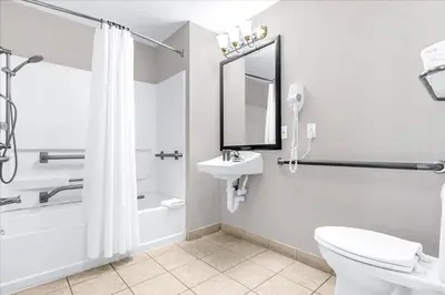 a bathroom with a shower toilet and a sink at Condo 1BR Near Disney- Pool and Hot Tub in Orlando