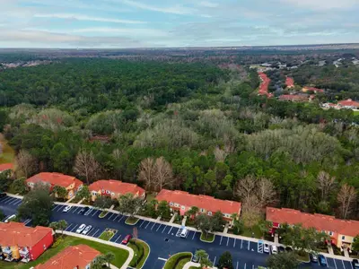 an overhead view of a school campus with trees at Natural Reserve Home at Emerald Islands in Kissimmee