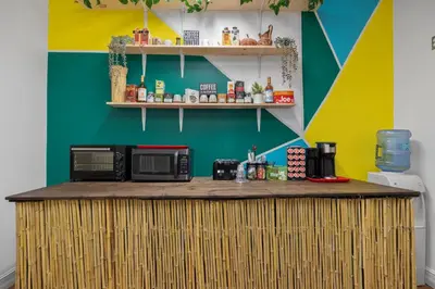 a counter with two microwaves on top of it at Banana Leaf Villa-Vintage Vibes- King Suite in Orlando