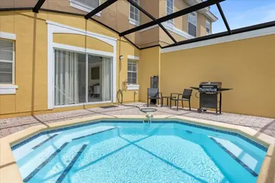 a swimming pool in the middle of a yard at 3 Bed 2,5 Bath Perfect Family home Bunk Beds townhouse in Kissimmee