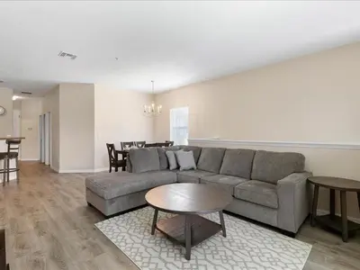 a living room with a couch and a table at Oakwater Retreat condo in Orlando
