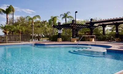 a large swimming pool with a gazebo at Your Vista Cay Lakeview Allure condo in Orlando