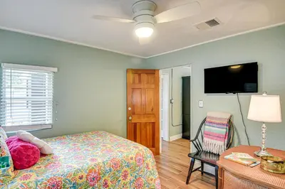 a bedroom with a bed and a flat screen tv at Walk to Historic Dtwn Sanford Home with Gas Grill! in Sanford
