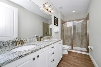 a white bathroom with a sink and a toilet at Marvelous Home With Private Pool And Waterpark Access Near Disney At Encore Resorts Reunion - 131La in Kissimmee