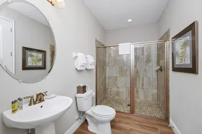 a bathroom with a shower and a toilet and a sink at Marvelous Home With Private Pool And Waterpark Access Near Disney At Encore Resorts Reunion - 131La in Kissimmee