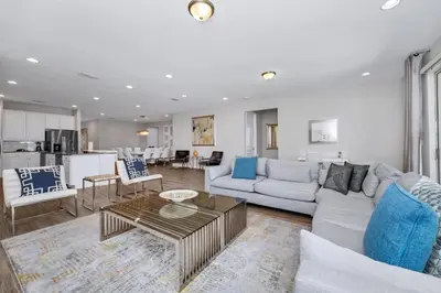 a living room with a couch and a table at Marvelous Home With Private Pool And Waterpark Access Near Disney At Encore Resorts Reunion - 131La in Kissimmee