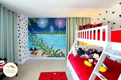 a childs bedroom with a red and white bunk bed at Amazing 6bd Resort Home Pool & Near Disney in Kissimmee
