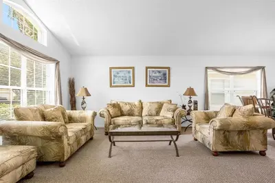 a living room with two couches and a table at 201 HB - Hideaway at TerraVerde in Kissimmee