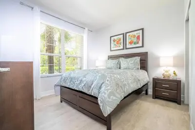 a bedroom with a large bed and a window at Charming 3Bd w Pool Close to Disney at Serenity 1639 in Orlando
