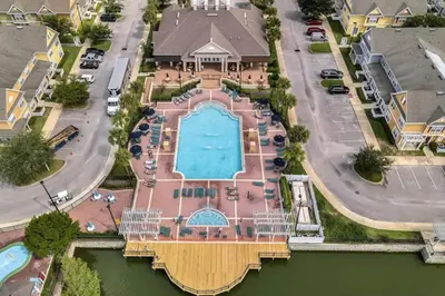 an aerial view of a house with a swimming pool at 4 Bedroom 3 Bathroom Villas At Seven Dwarfs 10-102 in Kissimmee