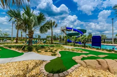 a golf course at the resort with a putting green at Themed 5BD Home Movie and Game Room 4726 in Kissimmee