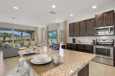 a kitchen and living room with a counter top at 7410 Marker Avenue in Orlando