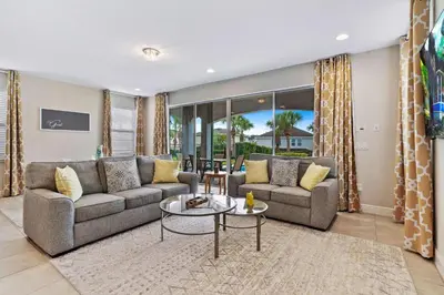a living room with a couch and a table at 7410 Marker Avenue in Orlando