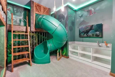 a green inflatable slide in a kids room at Brand NEW 12Bedrooms12Bathroom At Paradiso Grande in Orlando